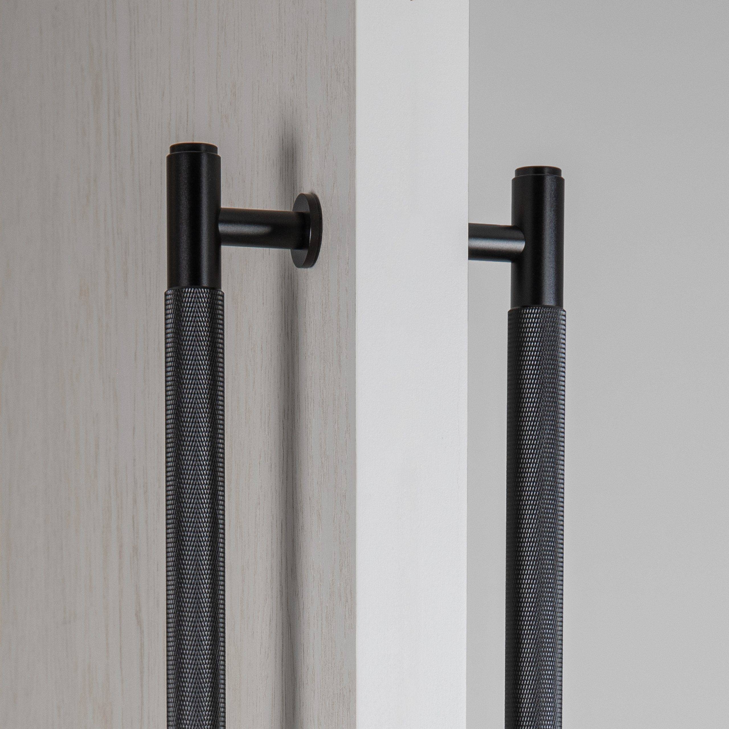 Close up of the Double Sided Closet Bar's through fixing on a timber and glass door