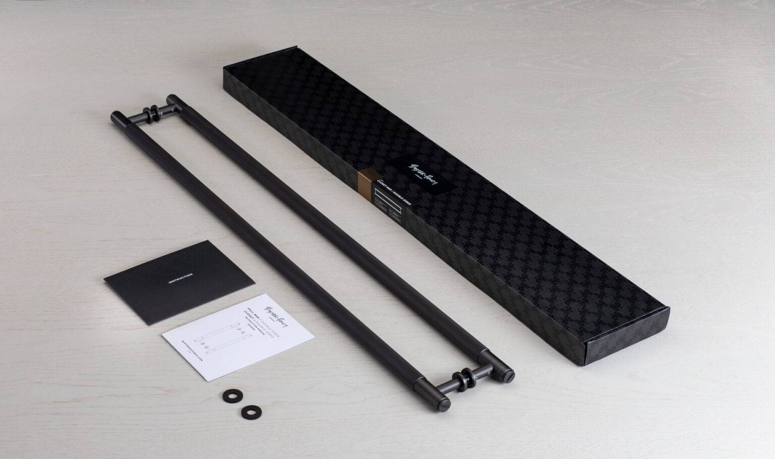 Double Sided Closet Bar box contents including two bars, washers and instructions