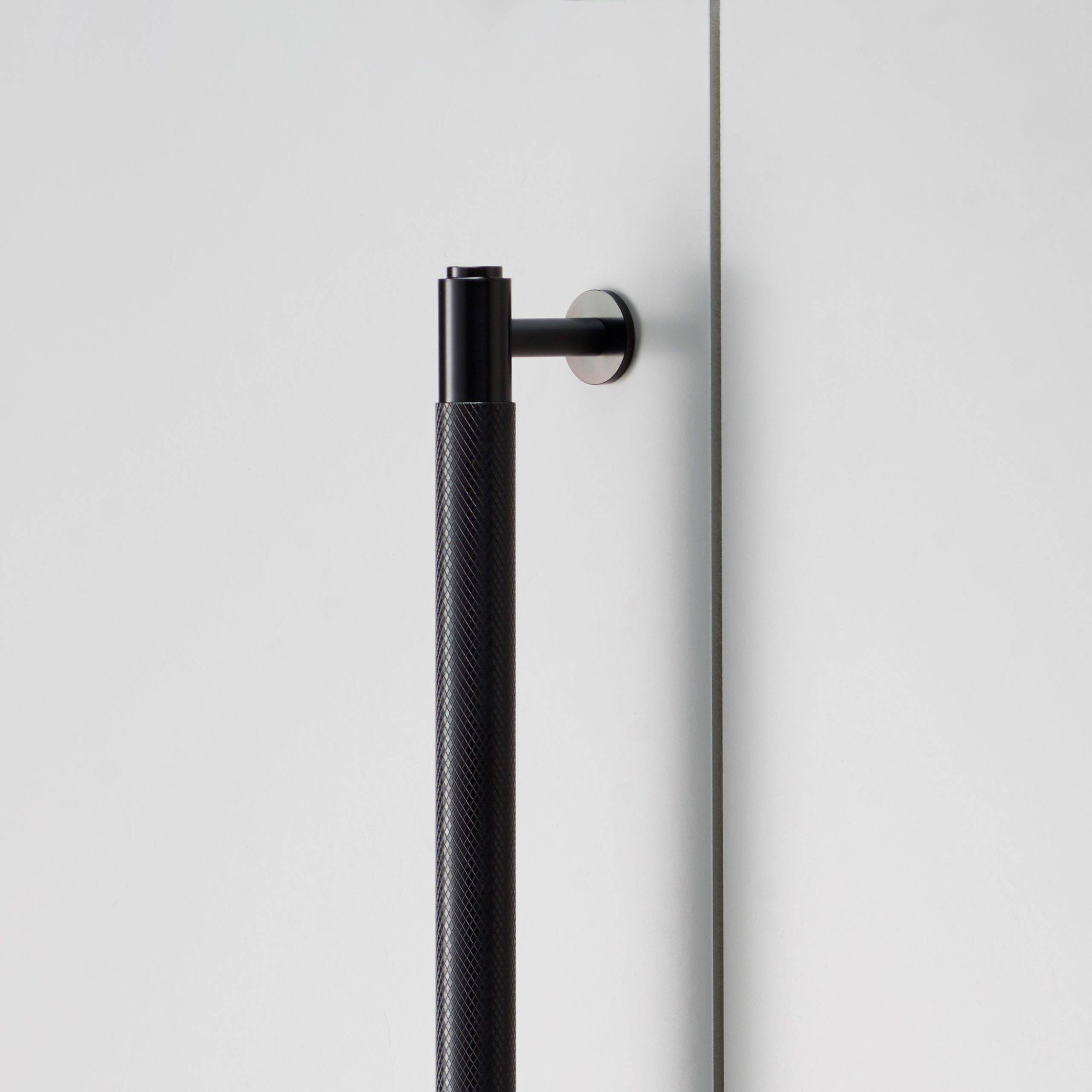 Close up of the Closet Bar's wall fixing and cross knurl texture in Black